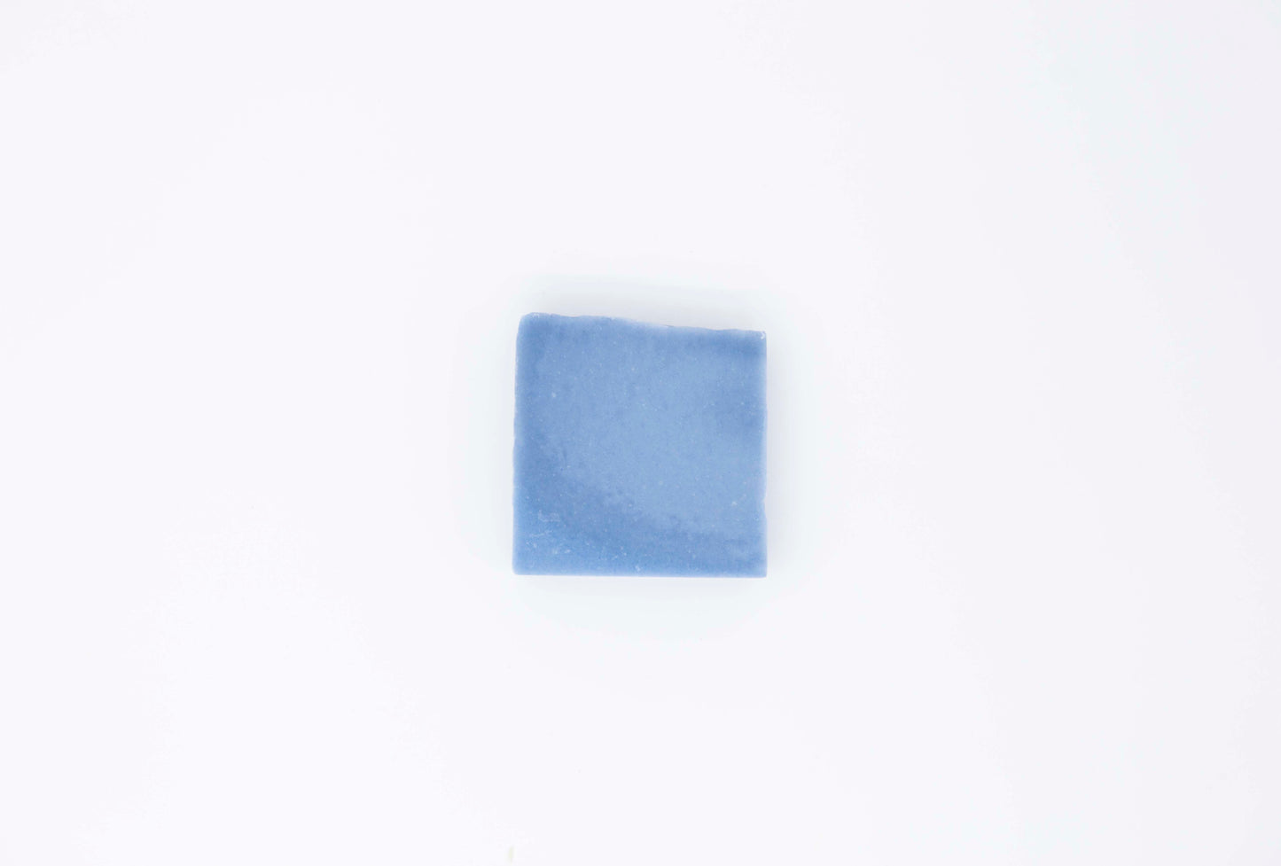 Royal cornflower blue eucalyptus soap bar sits on a clean white background.