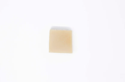 One creamy ivory white bar of Avocado Butter bar soap sits on a clean white background