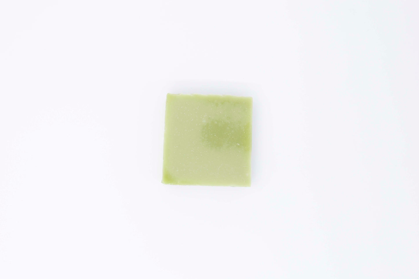 One bright fresh vibrant green bergamot pine soap bar sits on a clean white background