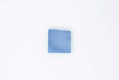 Royal cornflower blue eucalyptus soap bar  sits on a clean white background.