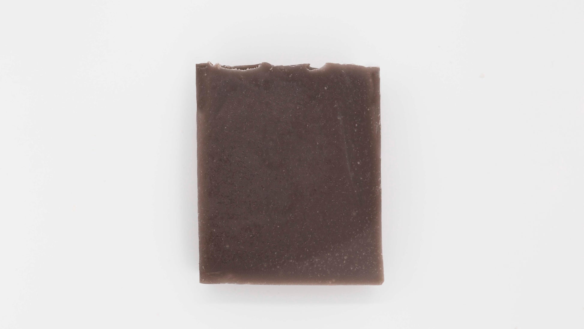 Close up image of a brown Cedarwood patchouli soap on a clean white background