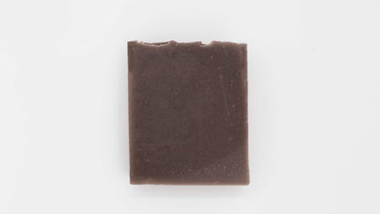 Close up image of a brown Cedarwood patchouli soap on a clean white background